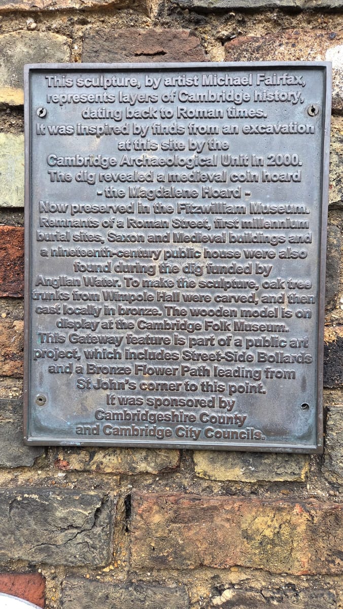 The plaque beside the sculpture
