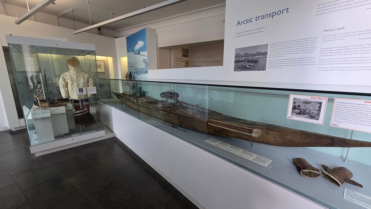 Arctic transport: a skin kayak with sealskin mitts beside it